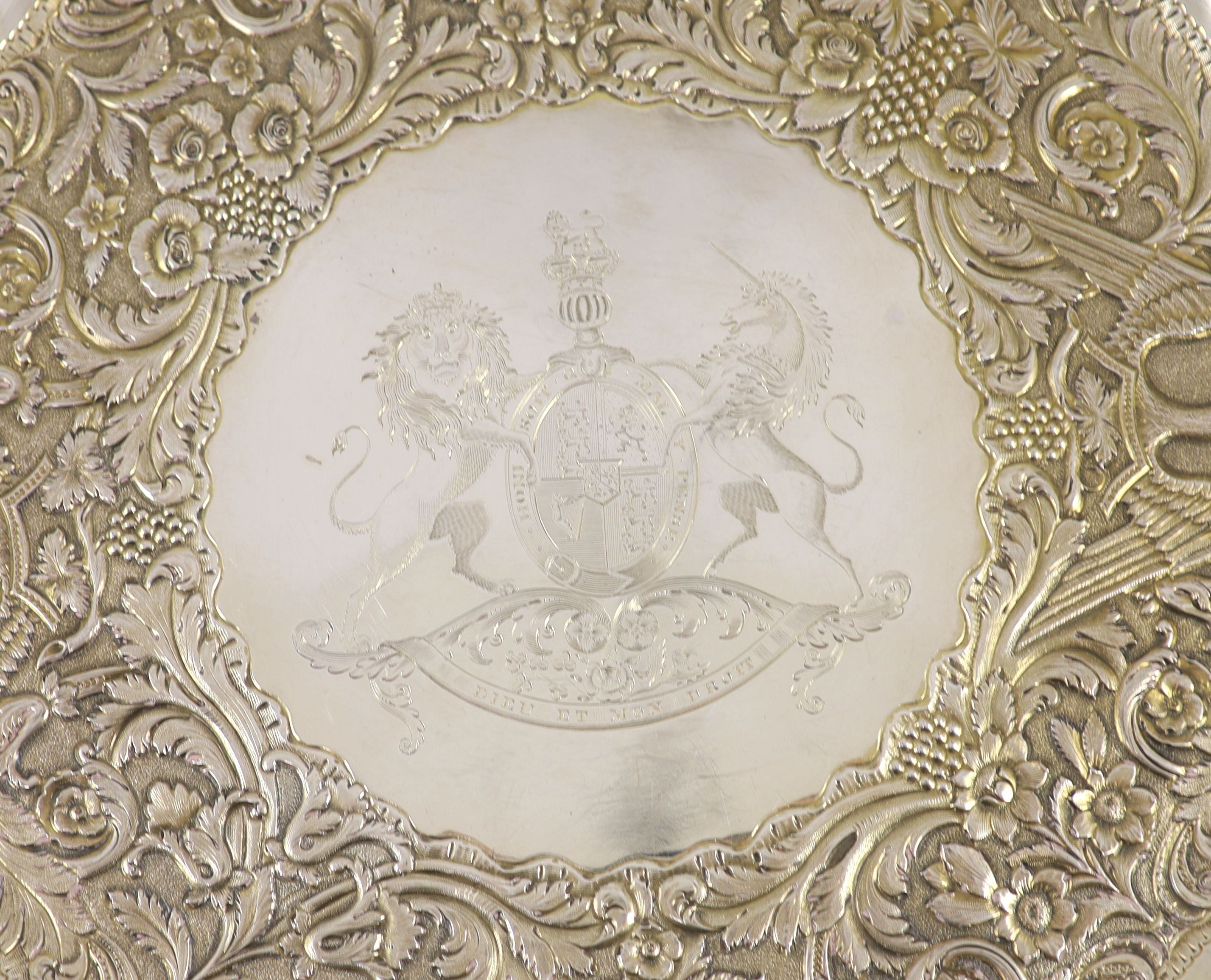 A William IV Irish embossed parcel gilt silver charger, by Robert W. Smith, engraved with the United Kingdom Royal Coat of Arms